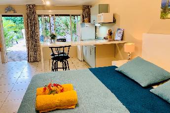 Garden View Studio sleeping and kitchen area