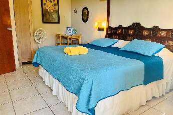 Garden Studio with ocean view terrace and king size bed