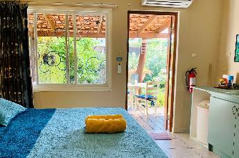 Garden Studio with ocean view terrace and king size bed